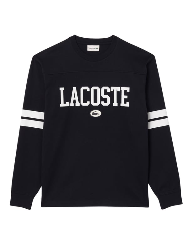 Das Lacoste Herren-Langarm-T-Shirt mit Rundhals-Ausschnitt präsentiert sich mit einem auffälligen Silikon Krokodil-Aufnäher vorne und sportlichen Kontraststreifen an den Ärmeln. Der Regular Fit verleiht diesem Shirt nicht nur einen zeitgemäßen Look, sondern auch höchsten Tragekomfort für einen lässigen und dennoch gepflegten Auftritt.
