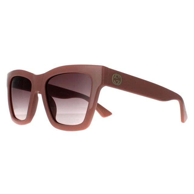 Gucci Square Womens Pink Brown Gradient GG1714S  Sunglasses are a masterful blend of modern sophistication and luxury, designed for those who appreciate bold fashion statements. With a distinctive, oversized frame featuring sleek, angular lines, these sunglasses add an edge to any look while maintaining an air of elegance. The iconic double-G logo on the temples underscores Gucci's legacy of impeccable craftsmanship and attention to detail. High-quality lenses offer excellent UV protection, ensuring comfort and safety under the sun. Available in an array of stylish colors, the GG1714S model is perfect for those looking to make a striking impression with an accessory that embodies both contemporary flair and timeless appeal.