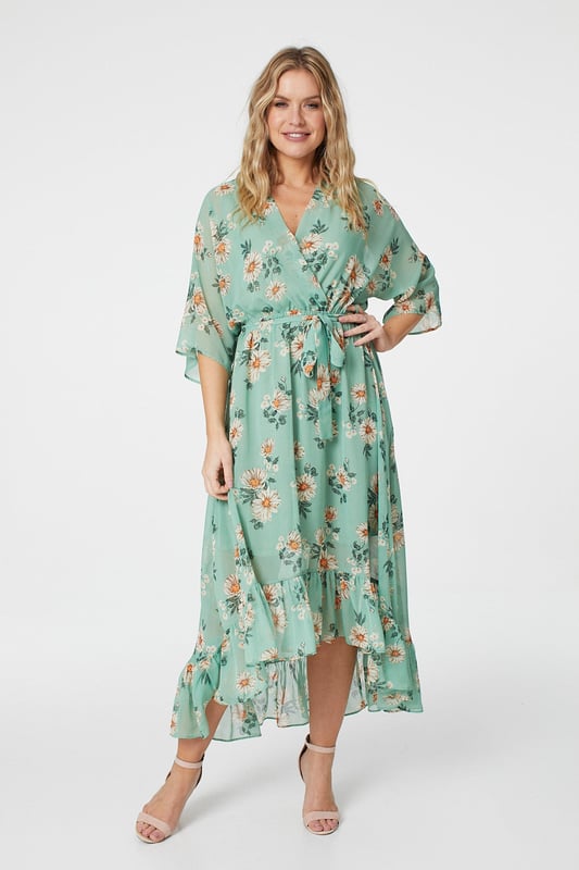 No warm weather collection is complete without a floral wrap dress. With a deep v-neck, batwing 3/4 sleeves with a semi sheer detail, a tie waist and a pephem midi skirt with a high low cut. Style with heeled wedges for an outdoor event or dress down for a sunshine break with sandals.