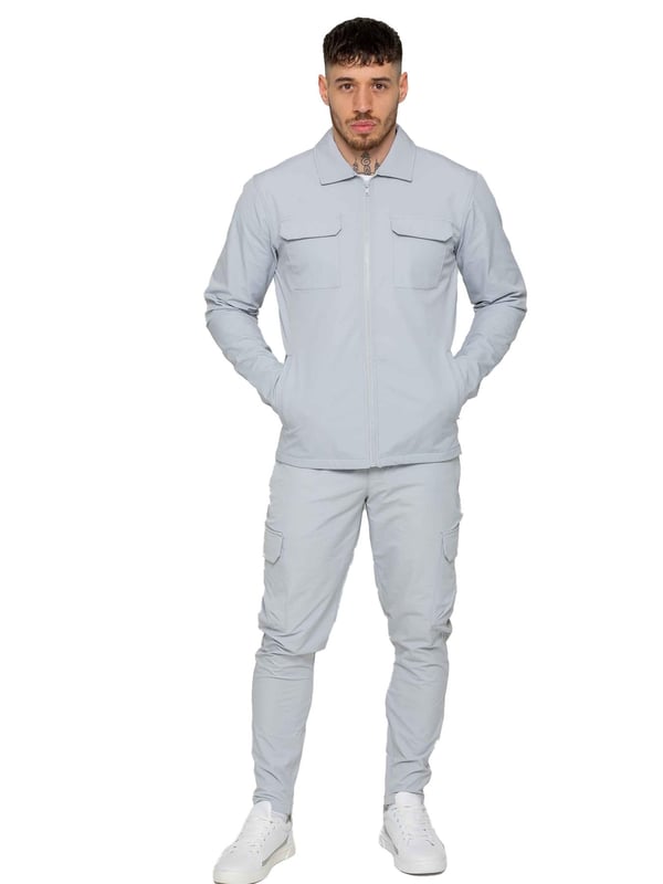 Enzo Mens Cargo Shacket Tracksuit Set. Zip Up Cargo Collared Shacket. Features Front Upper Cargo Pockets, Long Set in Sleeves, Stitched Trims on Cuff &  Hem. Set Completed With Cargo, Straight Leg, Slim Fit Trousers. Elasticated Waistband With Adjustable Drawstring. Two Slash Side Zip Pockets, Single Back Welt Pocket, Two Outer Cargo Pockets. Crafted With Premium Stretch Material. Modern, Stylish & Comfortable.