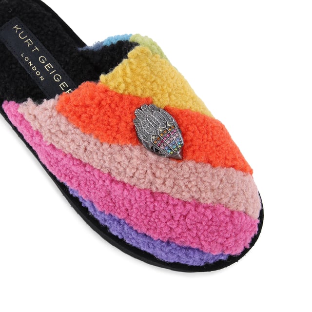 This Kurt Geiger Kensington Pump Slippers has a faux shearling upper in a rainbow stripe design. There is an antiqued silver eagle head with rainbow crystals on the toe. Sole height: 5cm.