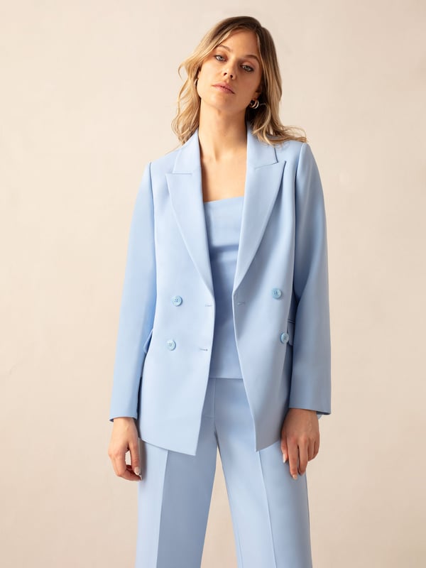 Co-founders' Notes

Introducing our Blue Double-Breasted Blazer, expertly crafted from a viscose blend premium crepe for a luxurious feel. This fully lined blazer showcases a trending blue tone, offering a sophisticated touch to your wardrobe. For a polished ensemble, pair it with matching trousers and a bandeau top, creating a stylish and cohesive look that transitions seamlessly from day to night.

Fully lined

Classic fit
Double breasted design
Classic, standard fit. Try your usual size



Fabric &amp; Care



Composition: Main: 74% Polyester 19% Viscose 7% Elastane Lining: 100% Polyester


Garment Care: Dry Clean Only



Size &amp; Fit


Classic, standard fit. Try your usual size

Length: 74cm (size 10)

Model is 170 cm/5'7" and is wearing a size 10