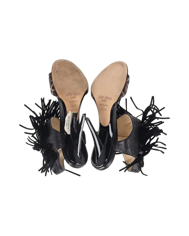 VINTAGE, RRP AS NEW
Add a touch of wild elegance to your footwear collection with the Jimmy Choo Leopard-Print Fringe Sandals. The leopard print is a bold choice that instantly elevates any outfit. The fringed details add a bohemian and eclectic touch, giving these sandals a unique and playful vibe. With an open-toe design and high heels, they are both stylish and flattering.

Jimmy Choo Leopard-Print Fringe Sandals in Black Leather
Condition: Very good with box
Sign of wear: Light wear on the soles and insoles, marks on the heel
Material: Leather
Color: Black
Size: IT36.5 / US6.5 / UK3.5
SKU: 357150 / TONPUGBSH357150W