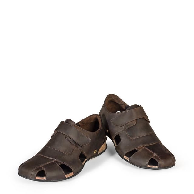 Step into comfort and style with our Panama Jack Men's Leather Sandals, the Fletcher Basic. Crafted for the adventurous soul, these half-open shoes offer a perfect blend of functionality and fashion. Experience unmatched comfort and durability with the Velcro Closure and natural greased nappa leather construction. Enjoy a luxurious feel with leather lining and anatomical insole, providing support and cushioning for all-day wear. Navigate any terrain with confidence, thanks to the flexible and durable TR rubber sole, ensuring stability and grip on outdoor adventures. Bullet Points: Velcro Closure for easy and adjustable fitNatural greased nappa leather construction for durability and styleLeather lining for luxurious comfortAnatomical insole for added supportFlexible and durable TR rubber sole for stability on various surfaces