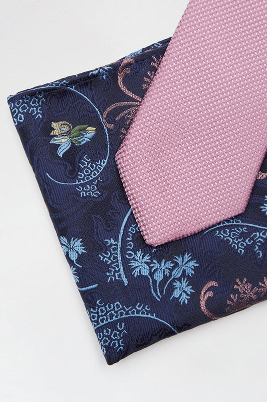 Complete the look with our collection of suit accessories. From classic bow ties, to lapel pins to braces and cuff links we've got everything you need to take suiting to the next level. Style: Pink Tie And Floral Pocket Set.  Ideal for: Occasion.  Design: Plain.  Model wears size UK 10 and is 5' 9" tall.