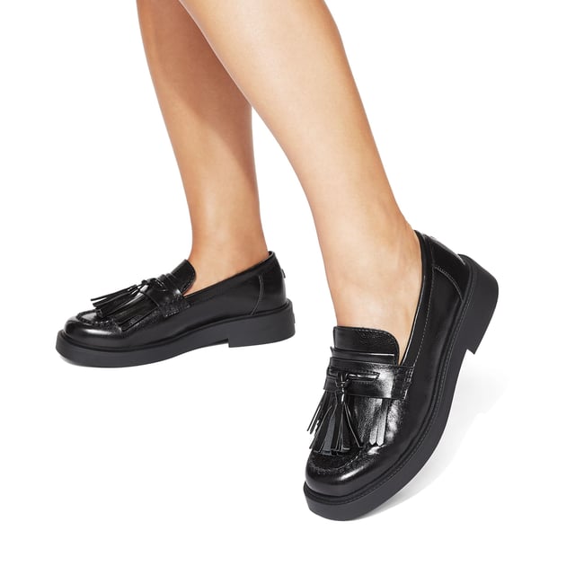 The KG Kurt Geiger Mack is a loafer featuring a black upper. There is a statement tassel detail on the toe.