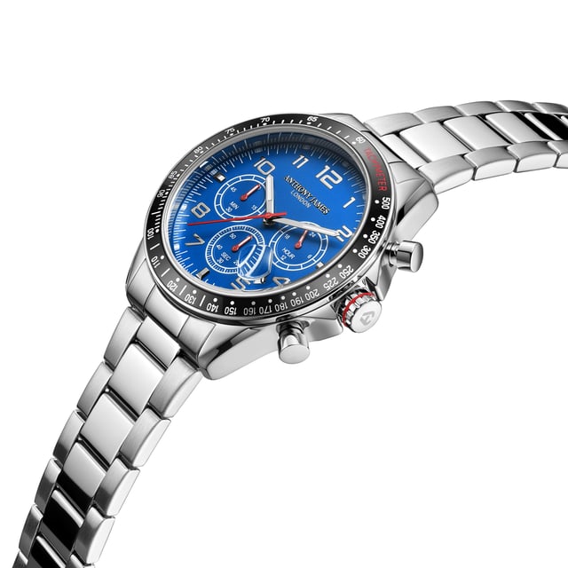 The Hand Assembled Anthony James  Tachymeter Chrono Steel Blue men’s watch boasts an array of exceptionally stylish and contemporary features ideal for gentlemen looking to enhance their look. The Quartz movement works the silver hour and minute hands that glow with white luminous features and are fitted against the sleek pacific-blue dial with UP indexes. The silver alloy case is enhanced by the Tachymeter bezel to easily measure your speed based on time and distance travelled, while the 202 stainless steel bracelet with wrapped links and a secure folded clasp and 304 stainless steel caseback provide the finalising details.
Quartz movement PE902
 Alloy case
Tachymeter Bezel with aluminium insert
3ATM Water resistant
 304 stainless steel caseback with snap-in
construction.
 Front mineral lens(bubble glass). 
Blue dial with UP indexes. 
Silver hour/minute hands with white luminous.
 202 stainless steel bracelet with wrapped links and folded clasp. 
Silver flash plating

Watch Dimensions:
Case Diameter- 43 mm
Case Thickness- 13.2 mm
Lug width- 20.1 mm
Strap width- 20 mm
Strap length- 178 mm
Weight- 130 grams