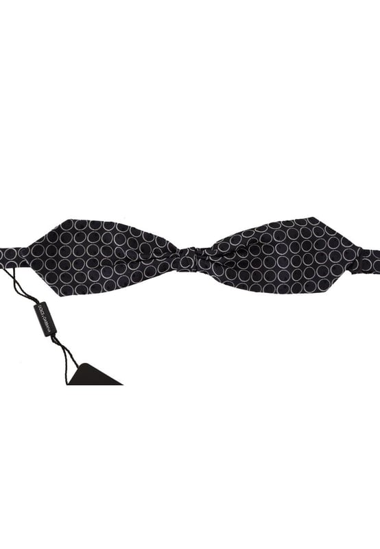 Stunning Dolce & Gabbana bow tie
  Color: Black and White Round
  Model: Tied
  Material: 100% Silk
  Adjustable length neck strap
  Made In Italy
  Width: 7cm