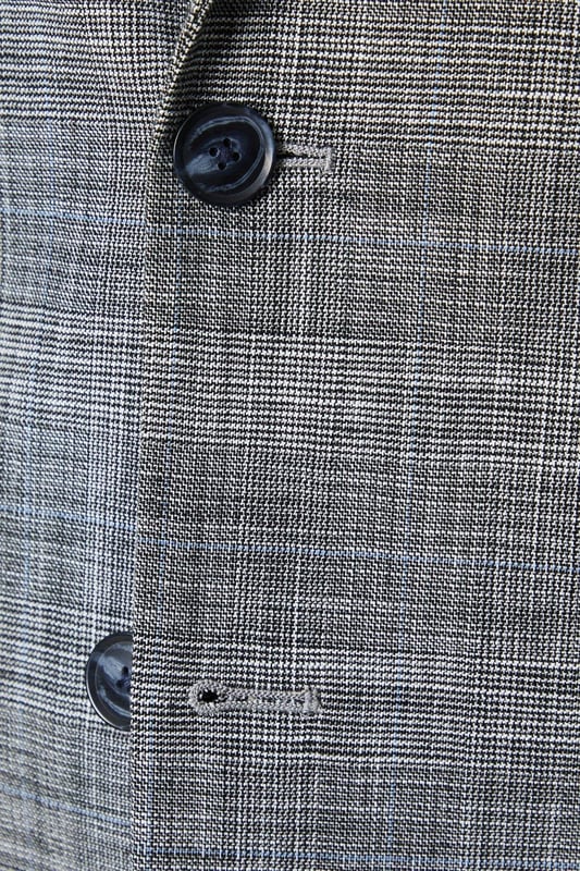 Tailored fit suit jacket crafted from a cotton-blend fabric
Half-lined construction for a lightweight and breathable wear
Notched lapel collar exudes a timeless, sophisticated aesthetic
Single-breasted design with a two-button closure
Flap pockets at the front add a functional touch

Effortlessly elevate your formal attire with this tailored suit jacket from Burton. Designed to flatter the masculine silhouette, it features a well-balanced fit that defines the shoulders, chest, and arms while allowing for ease of movement. Pair it with matching trousers and a crisp shirt for a polished ensemble suitable for smart casual events, business meetings, or evening soires where you want to make a refined impression.