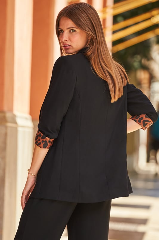 Black blazer with leopard print lining top