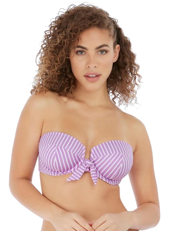 Freya's Beach Hut bandeau bikini top is versatile and chic, with adjustable straps that can be converted from straight to cross-over, or removed for the perfect look no matter what you are doing. The cups are underwired for support and lightly padded, giving your bust a smooth, round shape. The rear clip fastening will stay secure all-day long for worry-free wear. The chic knot detail and open-centre front design add a feminine, flirty touch.  Underwired, Lightly padded, Adjustable straps, Clip fastening, Front knot detail, Open-centre front, Removable, convertible straps, Country of origin: Sri Lanka, Composition: 69% Polyamide | 16% Elastane | 15% Polyester, Listed in UK sizes.   Bandeau Bikini Top
