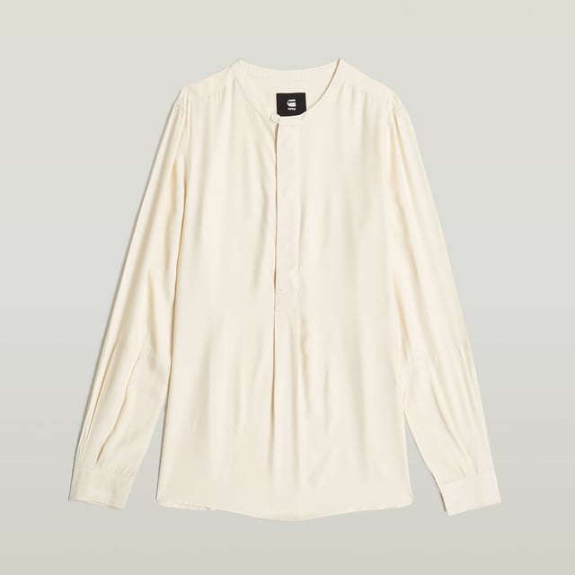 G-Star RAW Half Placket Top Neckline finished with a binding, button closure. Deep placket, hidden snap button closure. Cuffs, button. Volume pleat at the front and back. Side slits. Button closure. Top Half Placket offers a longer placket with hidden snap buttons. Pleats add volume to the front and back. An additional seam across the elbow adds shape. 58% Viscose, 42% Viscose LENZING™ ECOVERO™. Rigid