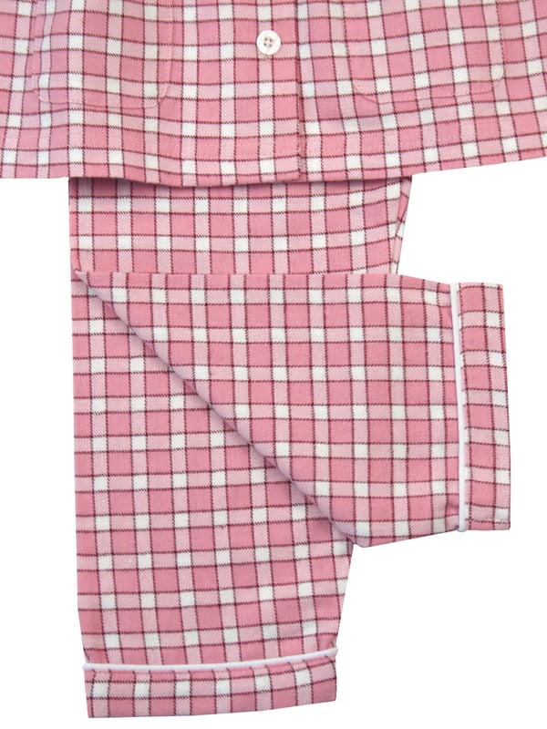 Our girls peony pink cotton pyjama set is where comfort meets feminine elegance. Made from soft and breathable cotton, these pyjamas are perfect for a restful night's sleep or lounging in style. The delightful peony pink check design adds sophistication to bedtime, making it a lovely experience for your little girl. Let her embrace a blend of comfort and fashion with these classic pyjamas, designed for a cosy nights and fashionable lounging.