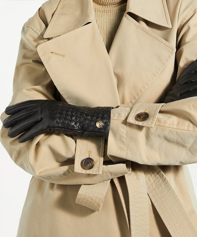 Elevate your winter wardrobe with Idols, exquisite woven leather gloves crafted from premium leather. Designed with stylish woven details and gold Dune London branding at the wrist for a sophisticated touch, these gloves are more than just a practical accessory on chilly days.