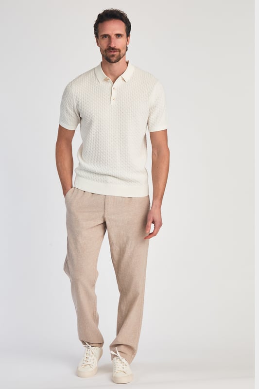 This textured polo shirt from Nines Collection blends classic sophistication with modern design. Crafted from a premium cable fabric with a subtle pattern, it offers a refined yet contemporary look. Lightweight and breathable, it’s a versatile choice for smart-casual occasions, ensuring style and comfort effortlessly. Made from 100% Cotton.