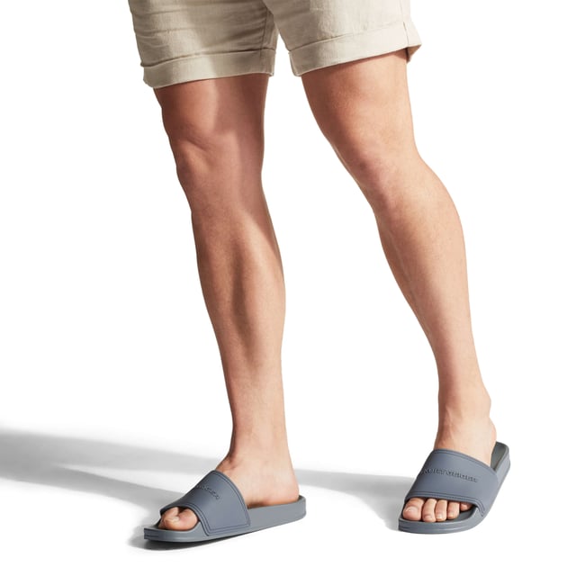 KG Kurt Geiger Ibiza Sandals Ibiza from KG Kurt Geiger is a flat slider sandal in grey.