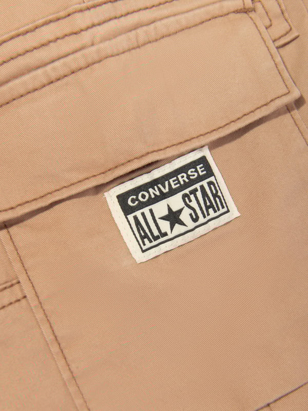 Introducing the Boys Lifestyle Woven Cargo Joggers in Brown by Converse. A chic wardrobe addition for your young man this SS2024. The key attributes include:‚ Urbane Design: Featuring a trendy cargo silhouette, these joggers offer a perfect blend of fashion &amp; function. ‚ High-End Quality: Made with premium, soft, and resilient material for optimum comfort and lasting wear.‚ Superior Detailing: With a distinctive Converse brand imprint, these joggers reflect a sophisticated yet playful style.‚ Versatility &amp; Comfort: Perfect for all-day activity, whether it's for casual outings or playful adventures.Elevate your boy's fashion game with these high-end Converse Lifestyle Woven Cargo Joggers in Brown. Order now for the era-defined style!