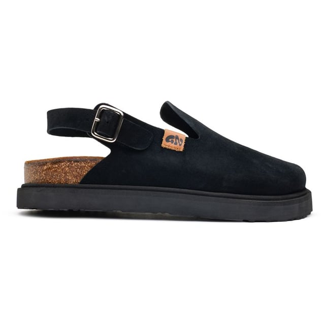 Step Into Comfort And Sustainability With The Frank Mules From Good News. Handcrafted For The Eco-conscious Man, These Black Suede Sandals Blend Style With Responsibility. The Upper, Made From High-quality Deadstock Suede, Ensures A Fashionable And Ethical Choice. Featuring A 100% Cork Footbed And A Recycled Corn Outsole For Durable Traction. The Adaptable Strap And Robust Buckle Guarantee A Perfect Fit.