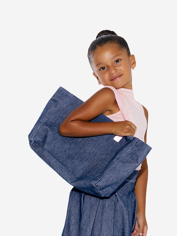 Carry life's essentials in style with this blue tote bag from AY by Ayla. The denim style piece exhibits a chic demeanour, elevating any look. Pink fleece handles are soft on skin and create a cute contrast. Pair with any other AY blue or pink garments for a cool coordinated look.