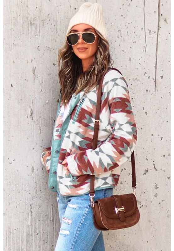 Stylish and trendy Red Western Aztec Buttoned Zipper Pockets Fleece Jacket
  Vibrant red color adds a pop of color to any outfit
  Western-inspired design with Aztec details
  Buttoned closures and zipper pockets for added functionality
  Made from soft and cozy fleece material
  Perfect for cooler weather
  Versatile addition to your wardrobe