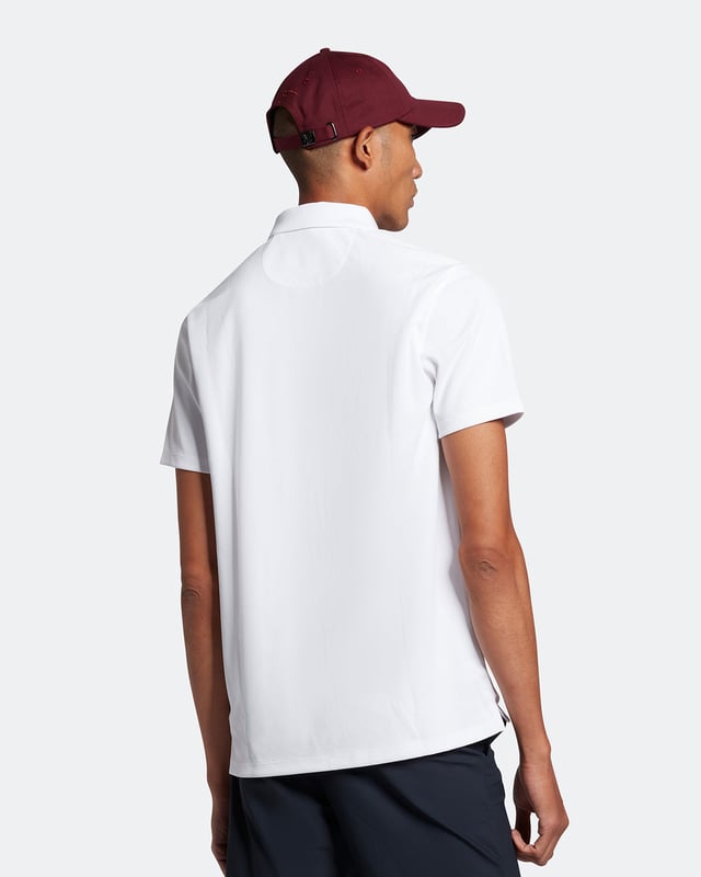 The Lyle &amp; Scott golf tech polo shirt. This regular-fit polo, is made from a recycled polyester blend and designed to be as lightweight as possible, with a three-button placket &amp; detail stitching on the collar and cuff.