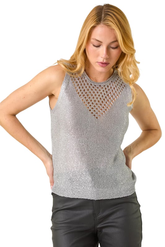 Metallic Cut Out Knitted Vest from Roman. Look effortless this season in our cut-out knitted vest perfect for the Autumn Winter. With a feminine round neckline and v-shaped cut-out detail, this sleeveless style is crafted from a soft lurex knitted fabric with a stunning metallic look. Pair this trendy piece with jeggings and ankle boots for a fashionable fall look!