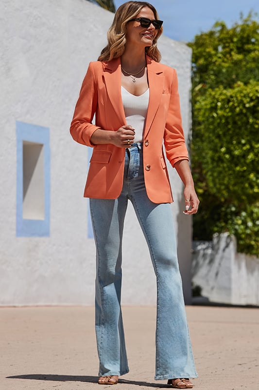 The bolder the better Cut for an on-trend relaxed fit Flattering longline hemTortoiseshell button fastening for a luxe feel Mood-boosting orange hue looks amazing with blue denim Add a white top to make it really pop