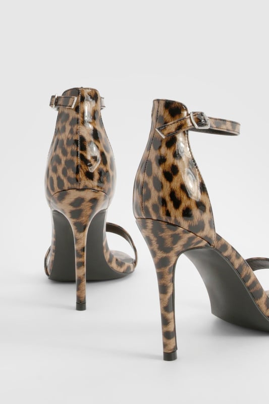 Striking leopard print design for a bold statement
        Sleek ankle strap with adjustable buckle fastening
        Elegant high heel measuring between 7 and 9cm
        Minimalist single strap across the toes for a modern look
        Versatile silhouette suitable for various outfits and occasions
    
    Make a fierce impression with these eye-catching leopard print heels from Boohoo. Perfect for the fashion-forward woman who loves to stand out, these shoes combine classic style with a wild twist. The slim ankle strap provides secure support, while the single strap across the toes keeps the design sleek and contemporary. Ideal for a night out on the town, these heels will effortlessly take you from dinner to the dance floor. Style them with a little black dress for a timeless look, or pair them with tailored trousers and a silk blouse for a more sophisticated ensemble. Whether you're heading to a cocktail party or a girls' night out, these versatile heels will ensure you're always dressed to impress.