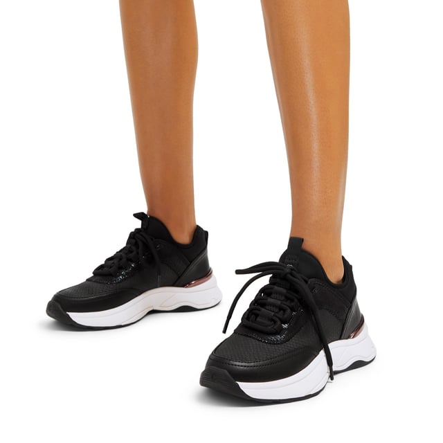 This Swift Runner trainer features a black snake embossed upper with lace up front. There is a gunmetal Icon C stud on the tongue tab and a matching gunmetal panel at the heel.
