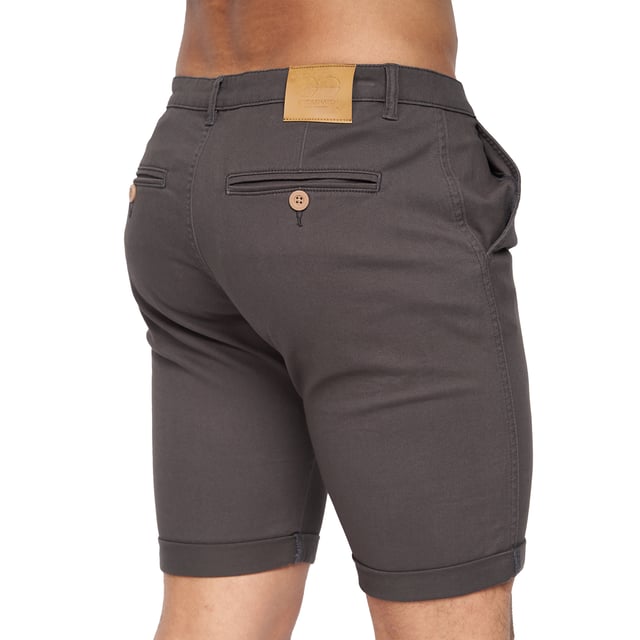 98% Polyester, 2% Elastane. Fabric: Canvas, Stretch. Design: Logo. Pockets: 2 Side Pockets, 2 Back Pockets, Jet Pocket, Buttoned. Fastening: Button, Zip Fly. Style: Chinos. Back Yoke, Belt Loops, Darted, Gripping Inner Waistband, Mock Horn Buttons, Self Fabric, Twin Needle Stitch.