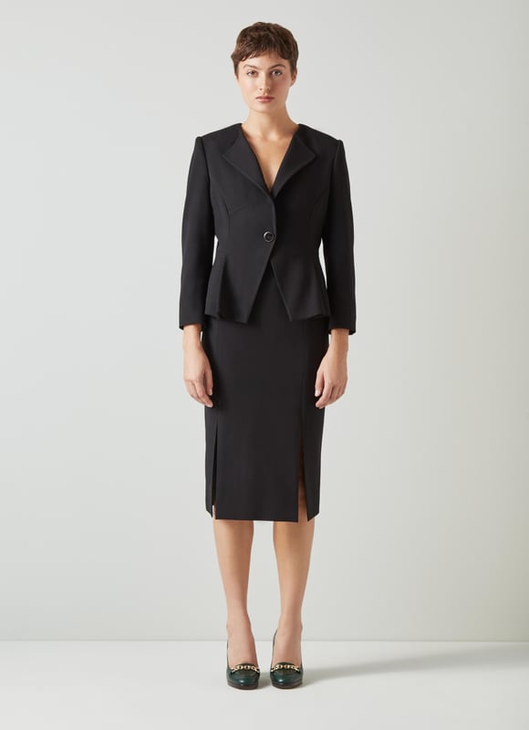 Beautifully tailored, totally timeless and kind to our planet, the new Sky jacket works as part of a wear-forever suit with the Sky skirt. Crafted in Europe from a black LENZING™ ECOVERO™ viscose* blend crepe, it's a shapely, single-button style with an open collar, a cut-away front and bracelet sleeves with button detail. Wear it with the matching pencil skirt when occasions call or for days in the office. This suit is a keeper. 

*More about the fabric
LENZING™ ECOVERO™ viscose uses up to 50% less emissions and 50% less water than standard viscose. This fibre relies on wood pulp, and is crafted from sustaibly maged tree species such as beech, spruce and eucalyptus.
