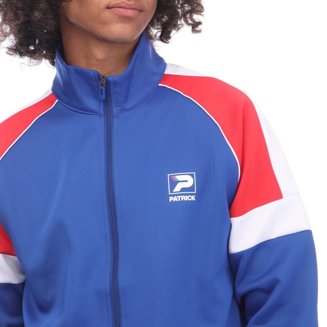 Men's Patrick Mick Track Top in Blue. The Mick Full Zip Track Top. Upgrade your wardrobe with this versatile track top. Featuring a funnel neck collar and ribbed hems and cuffs for the perfect fit, this track top is complete with cut and sew panels for added style and the Patrick print logo to the chest.- 96% Polyester, 4% Elastane. Ref: K1F00102402.