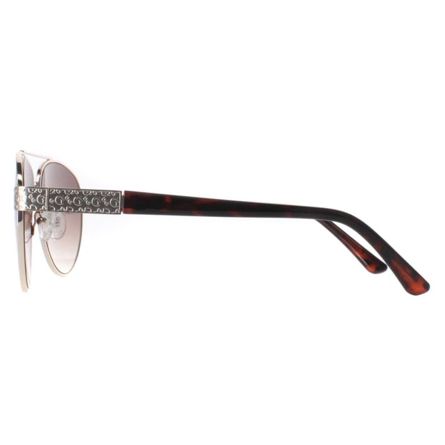 Guess Aviator Womens Gold Brown Gradient GF0414  Sunglasses feature a stylish, oversized frame made from high-quality acetate, providing a bold yet elegant look while ensuring durability and comfort. The lenses offer superior UV protection, effectively shielding your eyes from harmful rays and reducing glare. Adorned with the signature Guess logo on the temples and available in a variety of modern color options, the GGF0422 sunglasses add a touch of glamour to any outfit.