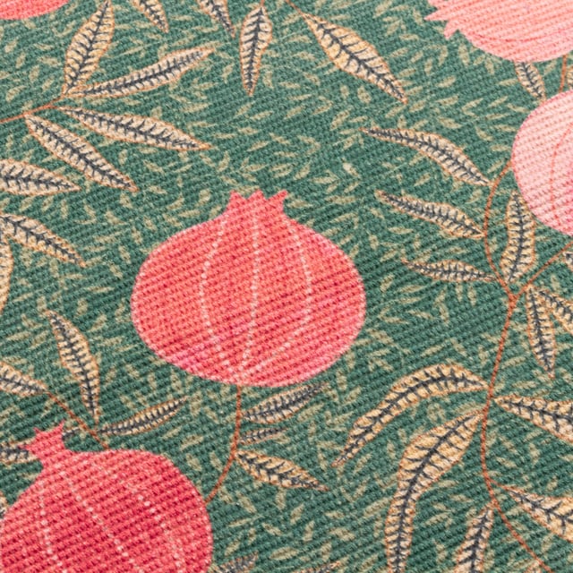 Displayed in all its glory, the Pomegranate set of four placemats is the perfect addition to your home this festive period. Digitally printed for exceptional clarity on a durable woven polyester fabric, the opulent, juicy fruits intertwine with gold leaves, complimenting the warming green background. A refreshing alternative to traditional festive decor, this beautiful set brings richness to the Christmas dining table and will look fantastic all year-round.