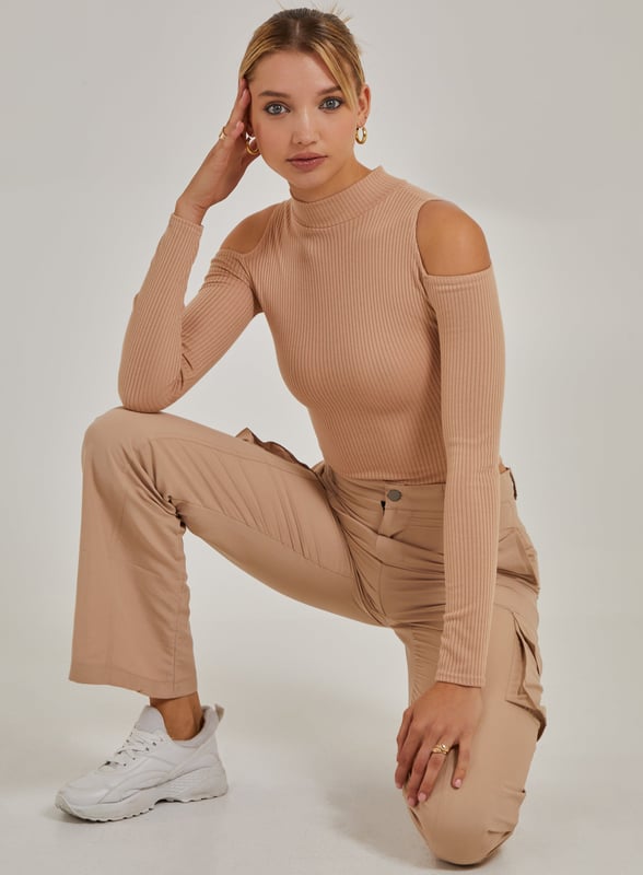 Need a last minute addition to the perfect outfit? Look no further. This Cold Shoulder Ribbed Bodysuit is the wardrobe essential you'll need this season.