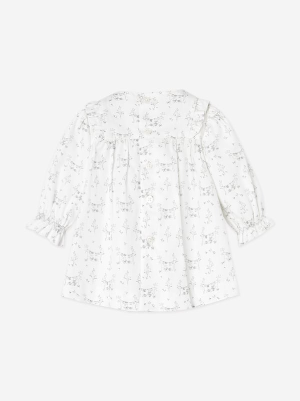 Introducing the enchanting Baby Girls Cotton Dress with Bloomers in White by paz_rodriguez, a treasure for AW2024. Let your little one shine in unmatched elegance with this handcrafted Spanish masterpiece. Key features include: Exquisite Craftsmanship: Meticulously made in Spain, ensuring unparalleled quality durability. Elegant Design: Classic white hue adorned with delicate details, perfect for any occasion. Comfort Meets Style: Crafted from soft, premium cotton for all-day comfort. Complete Set: Comes with coordinating bloomers for a polished look.Elevate her wardrobe with this chic, timeless ensemble. Perfect for celebrations and daily charm!