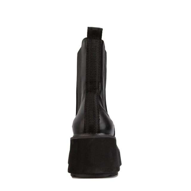 Botas altas Rocket Dog negras para mujer, confeccionadas en sintético y suela sintética. Características: altura de tacón 6 cm, forro textil, tirador en el talón, refuerzo elástico y tacón cuadrado.