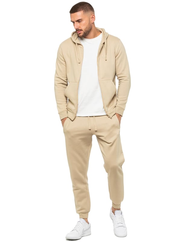Enzo Mens Zip Hoodie Tracksuit Set. Regular Fit, Long Sleeve Zip Hoodie. Cuffed Wrists, Adjustable Drawstrings. Features EZ Logo On Joggers. Regular Fit, Cuffed Joggers. Elasticated Waistband With Adjustable Drawstring. Features 2 Side Slash Pockets & Single Welt Back Pocket. Ideal to use for Casual and Work wear.