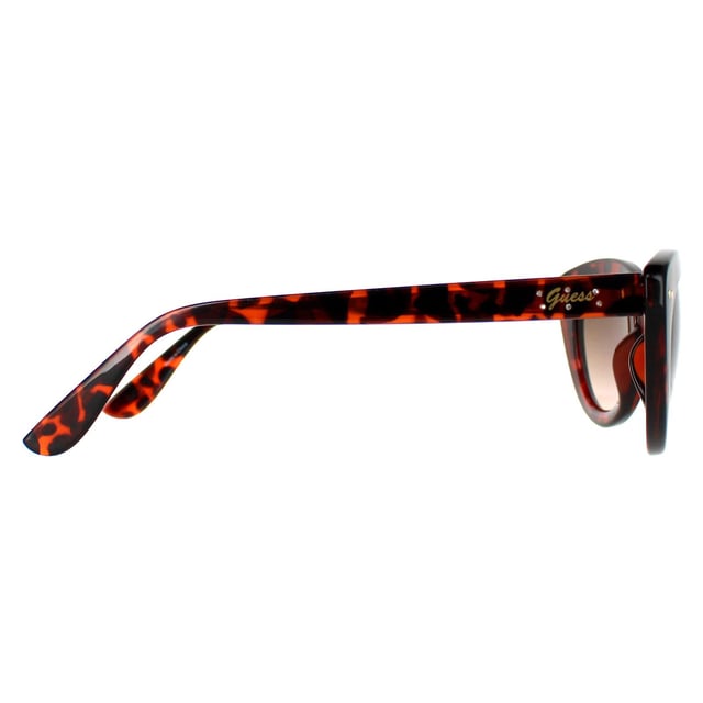 Guess Cat Eye Womens Gold Brown Gradient GF0402  Sunglasses are an alluring cat eye silhouette, adding a glamorous touch to any outfit. Crafted with meticulous precision, the lightweight yet durable frame, adorned with the iconic Guess logo on the temples, embodies a mark of refined taste and quality. Not just a fashion statement, these sunglasses prioritize eye protection, featuring high-quality lenses that offer excellent protection, ensuring both style and safety.