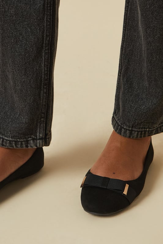 Charming bow detail adorns the front
        Comfortable flat heel (0-2cm height)
        Faux leather construction for durability
        Round toe design for a classic look
        Slip-on style for easy wear
    
    Step out in effortless style with these delightful ballerina flats from Dorothy Perkins. The eye-catching bow detail adds a touch of femininity to any ensemble, making these shoes a versatile choice for various occasions. Pair them with dark wash jeans and a flowy blouse for a chic brunch look, or wear them with a knee-length dress for a baby shower. The comfortable flat design ensures you can stay on your feet all day, whether you're running errands or meeting friends for coffee. These ballerinas are perfect for the fashion-conscious woman in her 30s who values both style and comfort. Their classic silhouette allows for easy transition from day to night, making them an ideal choice for family gatherings or casual outings. Embrace the trend-setting yet modest aesthetic of Dorothy Perkins with these charming flats that offer both elegance and practicality.