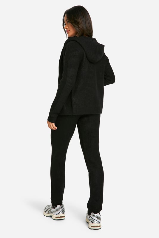Soft fine knit texture for ultimate comfort
        Zip-through hoodie design for versatile styling
        Coordinating trousers for a complete look
        Ribbed cuffs and hem for a snug fit
        Relaxed silhouette perfect for lounging or casual outings
    
    Embrace laid-back chic with this soft fine knit tracksuit from Boohoo. The zip-through hoodie and coordinating trousers offer a seamless blend of comfort and style, ideal for those lazy weekends or casual catch-ups with friends. Layer the hoodie over a simple white tee, as shown, for a classic look, or wear it zipped up for extra warmth. The relaxed fit allows for easy movement, making it perfect for running errands or lounging at home. Pair with trendy trainers and a crossbody bag for an effortlessly cool ensemble. For a touch of athleisure, style with statement socks and slider sandals. This versatile co-ord set is a must-have addition to your casual wardrobe, offering endless styling possibilities for the fashion-forward Boohoo girl.