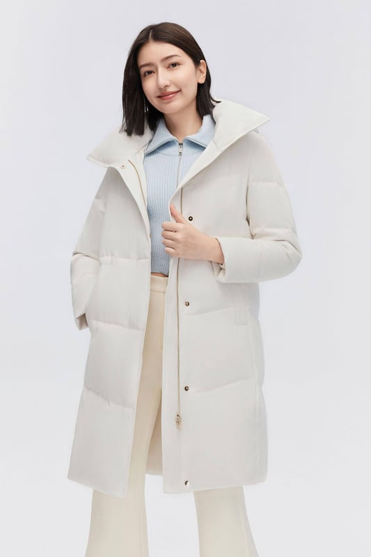 Crafted from smooth tech fabric, this lightweight coat offers windproof protection, stretchy inserts for freedom, and an adjustable drawstring waist.