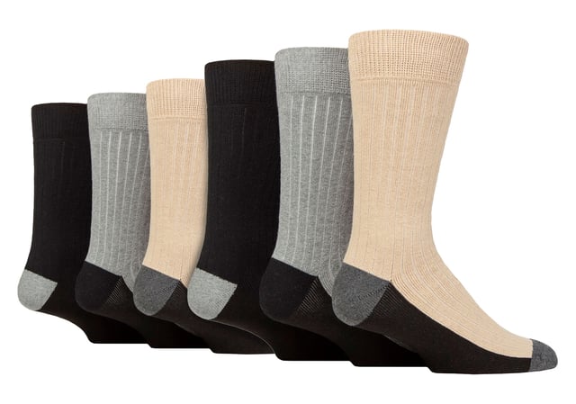 Step into a world of comfort and sustainability with these exceptional recycled cotton boot socks. Made with a focus on reducing environmental impact, these socks are a conscious choice for eco-conscious individuals. The cushioned design ensures comfort, making them perfect for all types of outdoor activities and everyday wear with boots. With 6 pairs of high-quality men's socks in each pack, you'll have the perfect companions for your adventures and daily routine. The ribbed knit legs offer a snug fit that ensures maximum comfort and prevents slipping. The terry loop pile lining adds an extra layer of warmth, making them perfect for the colder months. The fibre blend is principally cotton that has been derived from recycled sources, meaning that by wearing them, you’re stepping up with Wildfeet in helping reduce waste and encourage sustainability in production. Designed to withstand the demands of everyday wear, these socks feature reinforced soles, toes, and heels for enhanced durability and extended lifespan. You can trust these socks to last on all your outdoor adventures, providing reliable support and protection. Wild Feet is a range of socks featuring cool designs, bold colours and quirky catchphrases - from pugs and penguins, to lions and llamas! Choose from a range of styles for men and ladies, from dress to trainer socks. There are even some novelty styles available! These socks are available in 3 styles. They come in one size: Men’s 6-11 UK, are made from 45% Recycled Cotton, 41% Polyester, 11% Polypropylene, 2% Elastane, 1% Polyamide and are machine washable.
