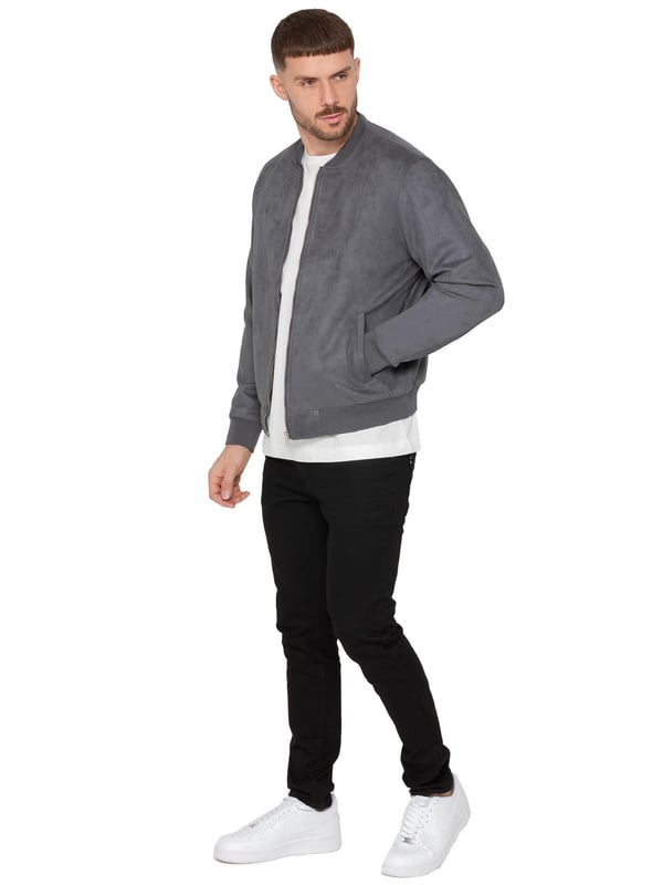 Introducing the Men's Suede Bomber Jacket, a versatile and fashionable wardrobe staple, perfect for layering. Made from soft suede, this jacket offers a luxurious texture and feel. It features a timeless bomber style with a zip-up front, ribbed cuffs, and hem for a comfortable, fitted look. Ideal for both casual and smart-casual settings, the premium suede enhances any ensemble with a touch of sophistication. The jacket also includes two convenient side pockets and an interior pocket for added functionality.