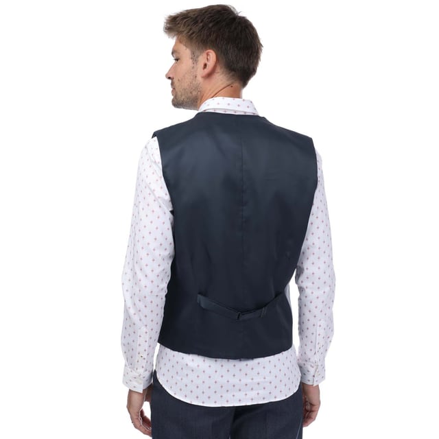Ted Baker Formal Waistcoat voor heren in blauw.- Single breasted gilet met 5 knopen voor.- Comfortabele, ademende stof.- Slim fit.- Buitenkant: 88% Wol, 8% Polyester, 4% Elastaan. Ref: TB023WS.