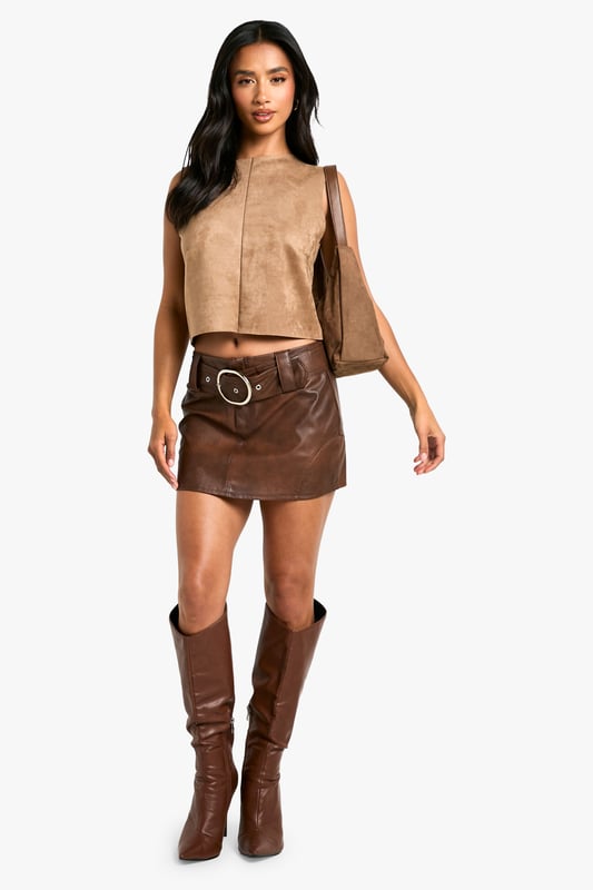 Petite Faux Suede Racer Top Gain some serious style points this season in our petite tops. Cut shorter to ensure the perfect fit, our tops for petite women are designed for queens 5'3'' and below. From petite t-shirts to women's petite blouses, we've got all the new-season styles you need in your wardrobe. Feeling casual? Dress it down with your fave pair of denim jeans and a leather. If out out is more your vibe, team with some leather trousers and high heels to make a statement!Style: TopFabric: Faux Suede