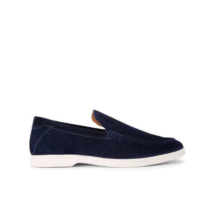 This KG Kurt Geiger Ryan is a navy suede slip on loafer with sleek upper. There is embossed branding on the back of the ankle.
