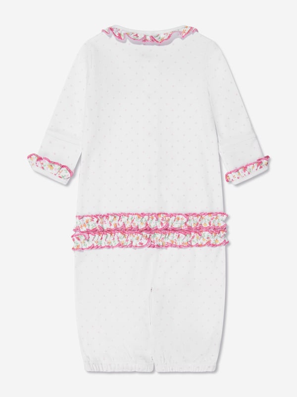 Magnolia Baby depict soft sophistication into their refined products. This baby girls pink babygrow converter is reflective of the label's precision of beauty and intricate focus. Made in Pima cotton with ruffled elasticated trims, polka dot patterning and embroidered floral detailing. She will look and feel divine. Crew Neck  Brand Tag Polka Dot Patterning  Press Stud Fastening Elasticated Trims Long Sleeves  Ruffled Trims Pima Cotton  Embroidered Floral Detailing