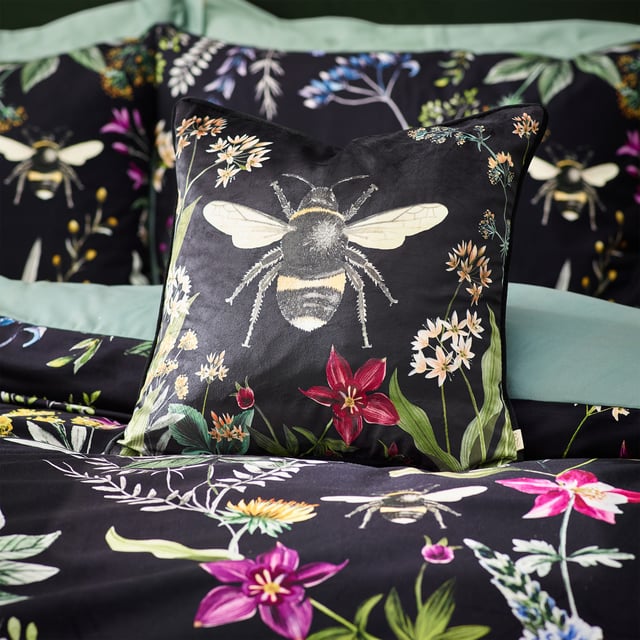 A striking digitally printed duvet set featuring an eye-catching contrast design, which will brighten up your bedroom in an instant, Busy bees hover among the bright, fresh florals of a meadow or garden, which are set on a contrasting luxuriously soft velvet jet black background. This exquisite set adds lovely pops of colour to your bedroom and gives it a natural feel too, helping you wake up in the morning and feel refreshed.