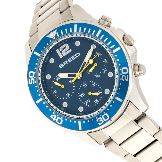 Brushed Alloy Case; Precision Japanese Quartz Movement; Non-Glare Scratch-Resistant Mineral Crystal; Logo-Engraved Stainless Steel Caseback; Polished Alloy Bracelet; Logo-Engraved Stainless Steel Fold-Over Push-Button Deployment Clasp; Luminous Hands; Luminous Markers; Day Sub-Dial; Date Sub-Dial; 24-Hour Sub-Dial; 46mm Case Diameter; 5ATM Water Resistance;